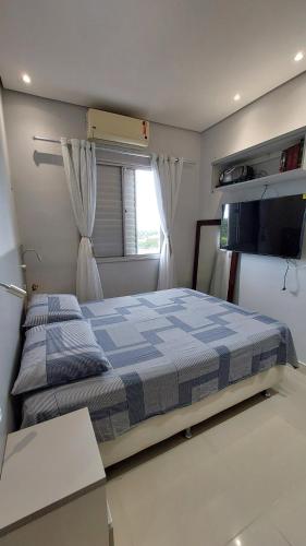 En eller flere senge i et værelse på Apartamento 2 quartos para a cop 30