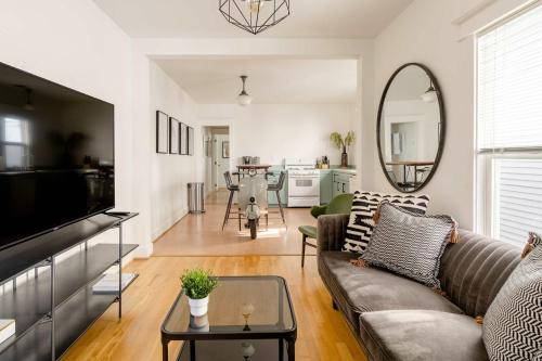 a living room with a couch and a table at Hipster Vibe Apartment - Food Carts & Live Music in Portland