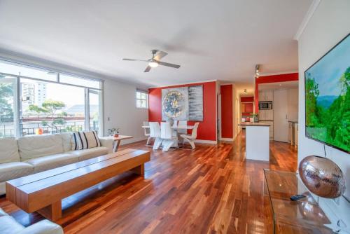 a living room with a couch and a table at Spacious City Apartment - Walk to Casino, MCEC & MCG in Melbourne