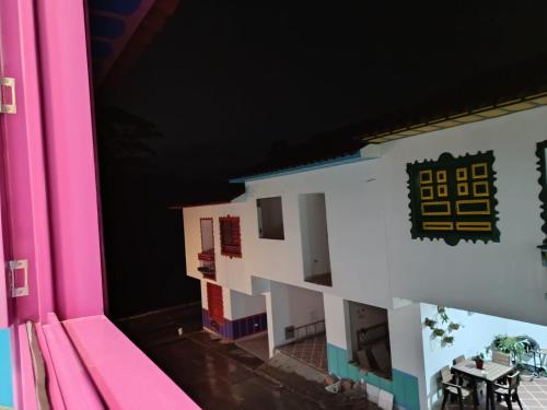 a lego model of a building with a table at Jardinhabs - JARDÍN in Filandia