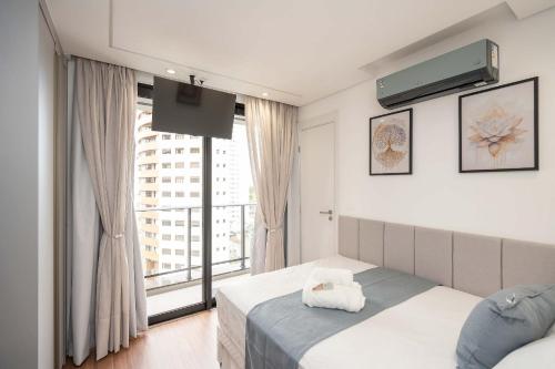 Postel nebo postele na pokoji v ubytování Modernidade no Batel | Suíte luxo