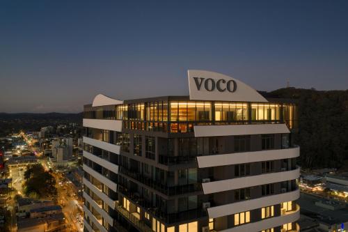 a building with a voco sign on top of it at voco Gosford by IHG in Gosford