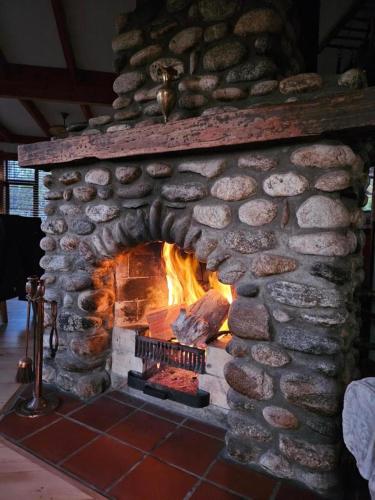 a stone oven with a fire in it at Beaconstone - your perfect escape in Charleston