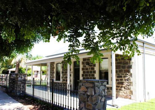 a house with a fence in front of it at Barossa Bed & Breakfast in Tanunda
