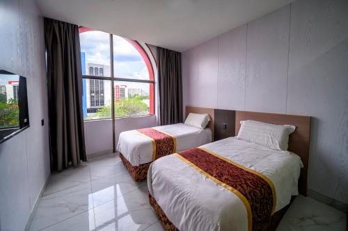 Postel nebo postele na pokoji v ubytování Hotel LBS