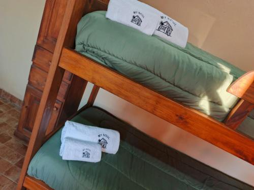a couple of bunk beds with towels on them at My Soul in Camet Norte