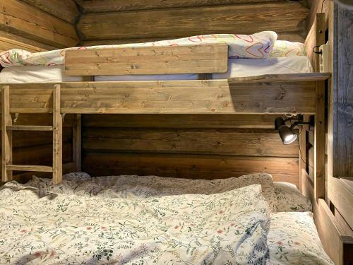 Ένα ή περισσότερα κρεβάτια σε δωμάτιο στο Newly Built Log Cabin Near Hardangervidda