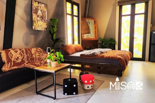 Postel nebo postele na pokoji v ubytování Celine's Loft