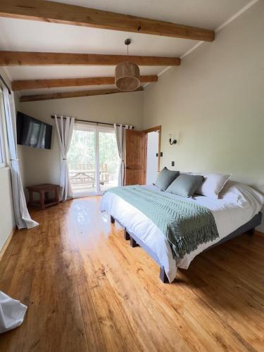 Postel nebo postele na pokoji v ubytování La Magnolia Aldea Molco