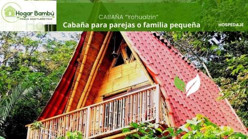 a tree house with a balcony on top of it at Cabañas Hogar Bambu Cuetzalan in Cuetzalán del Progreso