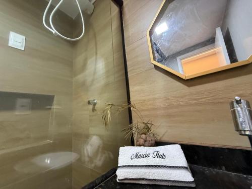 a bathroom with a sink and a tub and a towel at 509 Flat praia piscina barzinho Intermares in Cabedelo