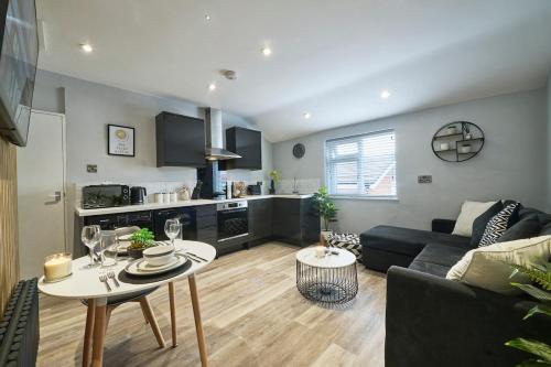 a living room with a couch and a table at 2 BDR Apt By Eason Stays Short Lets & Serviced Accommodation Denton Manchester With Free Parking in Manchester