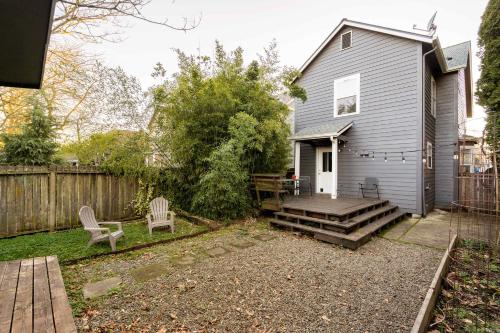 a backyard with a house and a wooden deck at Stay Portland - Alberta Arts Luxury, Sleeps 6, Walk Score 99 in Portland