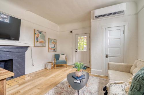 a living room with a couch and a fireplace at Stay Portland - The Garden Bungalow on Broadway - 94 WalkScore in Portland