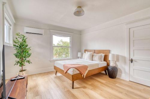 a bedroom with a bed and a window at Stay Portland - The Sullivan's Gulch Retreat - 94 Walk Score in Portland