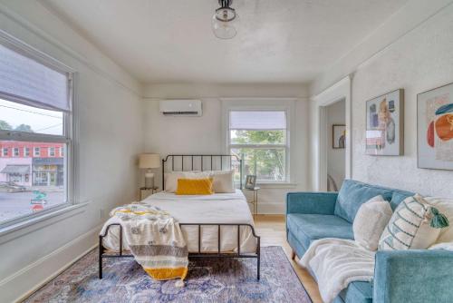 a living room with a bed and a couch at Stay Portland - The Bohemian Bungalow on Broadway - 94 WalkScore in Portland