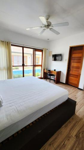 Ένα ή περισσότερα κρεβάτια σε δωμάτιο στο Panglao Ramyer Villa 2