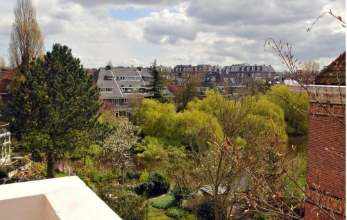 a view of a city with buildings and trees at Dutch Design Hotel Vondelpark in Amsterdam