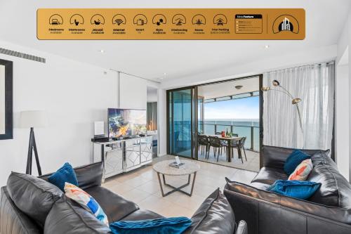 a living room with a leather couch and a view of the ocean at Soul - Private Apartments - Apartment Stay in Gold Coast