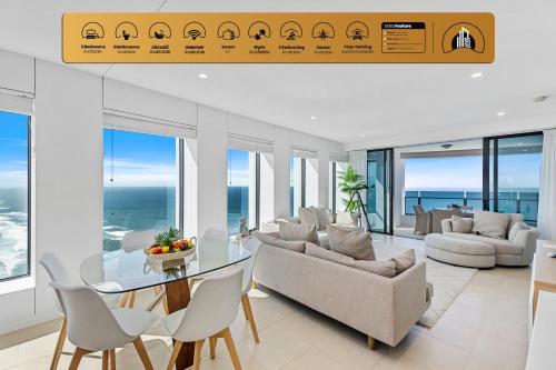 a living room with a table and chairs at Soul - Private Apartments - Apartment Stay in Gold Coast