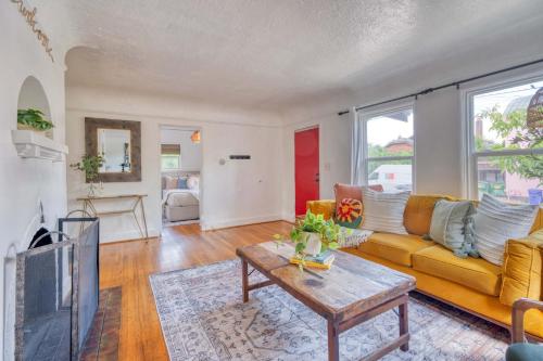 a living room with a couch and a table at Stay Portland - Sedona Vibes in PDX- Walk to Local Shops & Coffee in Portland