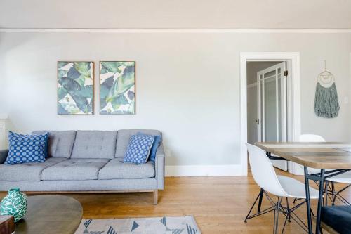a living room with a couch and a table at Stay Portland - Alberta Arts Haven - 2BR - 4 Guests - Walk to Eats in Portland