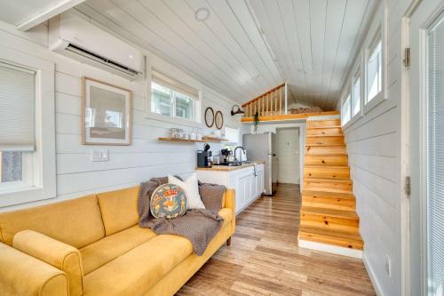 a living room with a couch and a kitchen at Stay Portland - The Tiny Saguaro - Walk to Local Shops & Eateries in Portland