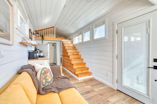 a living room with a couch and a staircase at Stay Portland - The Tiny Saguaro - Walk to Local Shops & Eateries in Portland