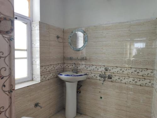 a bathroom with a sink and a mirror at Serenity Stay Rangrik in Kaza