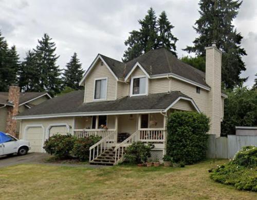 a house with a car parked in front of it at Private house guest rooms in Bellevue, WA in Redmond
