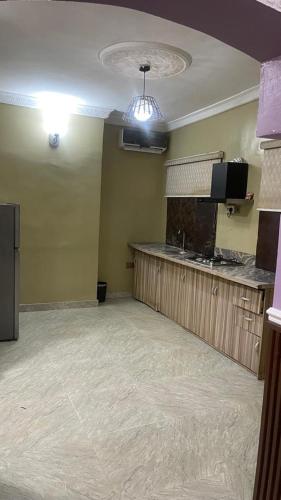 an empty room with a bar in a restaurant at PnK Inn in Adeleye
