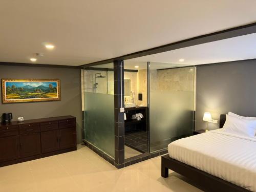Postel nebo postele na pokoji v ubytování Kooters Guesthouse Bali