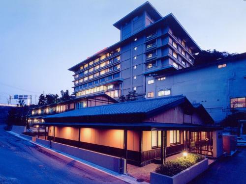 a large building with lights in front of it at Yamamura Bekkan in Nagato