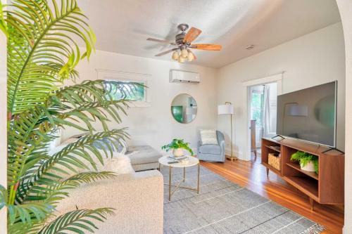 a living room with a couch and a ceiling fan at Cute & Comfortable Portland Home with 91 WalkScore in Portland