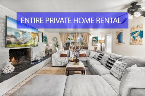 a living room with a couch and a fireplace at Entire Private Home with 4 Bedrooms 2 Bathrooms, Spacious, Lux King Bed, Ranch Style, Prime Area, Available Now in La Mesa
