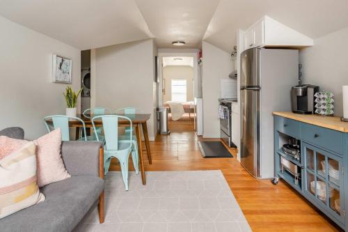 a kitchen and living room with a couch and a table at Stay Portland - Cozy Attic Hideaway in Laurelhurst in Portland