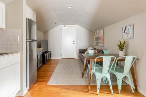 a kitchen and dining room with a table and chairs at Stay Portland - Cozy Attic Hideaway in Laurelhurst in Portland