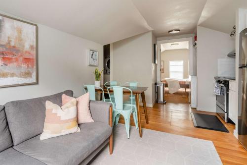 a living room with a couch and a table at Stay Portland - Cozy Attic Hideaway in Laurelhurst in Portland