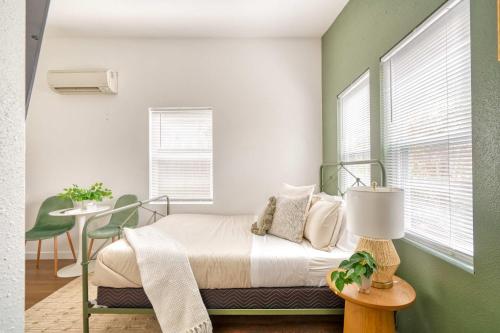 a bedroom with a bed and a table with a lamp at Stay Portland - Urban Cabin Studio - Breweries & Local Eateries in Portland