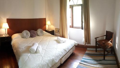 Un pat sau paturi într-o cameră la Alojarte Mendoza