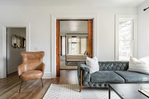 a living room with a couch and a chair at Stay Portland - The Étoile Suite - Nob Architecture & Boutiques in Portland