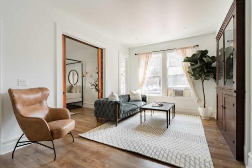 a living room with a couch and a chair at Stay Portland - The Étoile Suite - Nob Architecture & Boutiques in Portland
