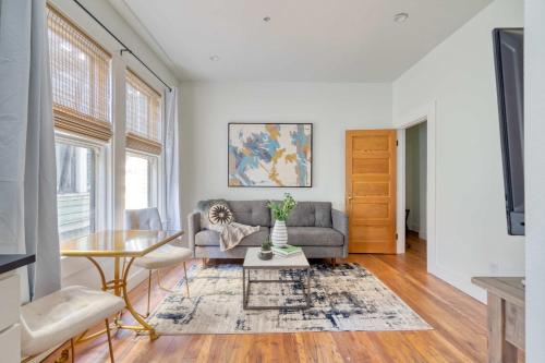 a living room with a couch and a table at Stay Portland - The Etourdissante Suite - Forest Park & Local Eats in Portland