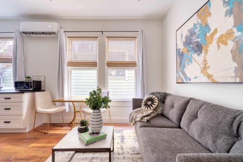 a living room with a couch and a table at Stay Portland - The Etourdissante Suite - Forest Park & Local Eats in Portland