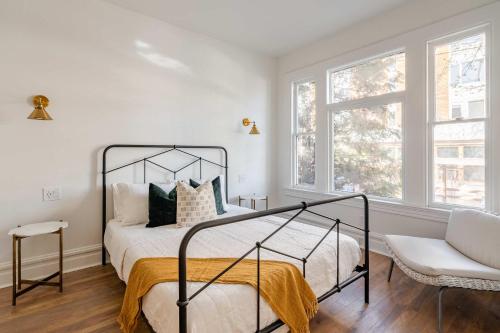 a bedroom with a bed and a chair and a window at Stay Portland - 1BR - Walk to Coffee, Brews & NW 23rd Shops in Portland