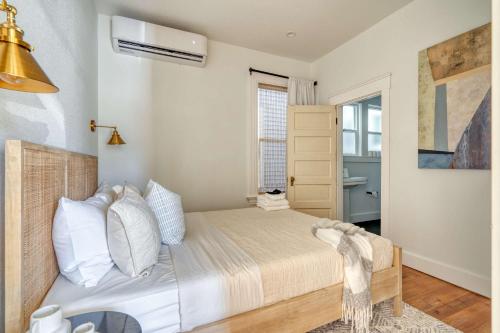 a bedroom with a bed and a window at Stay Portland - The Charmante Suite- Breweries & Boutiques in Portland