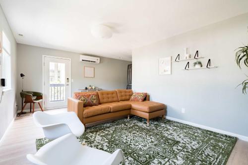 a living room with a couch and a rug at Luxurious Portland 3BR in the Pearl District in Portland
