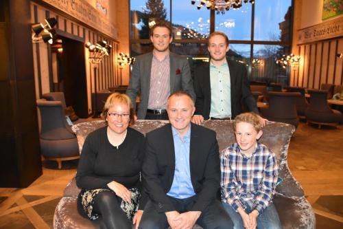a group of people sitting on a couch at Hotel Gletschergarten in Grindelwald