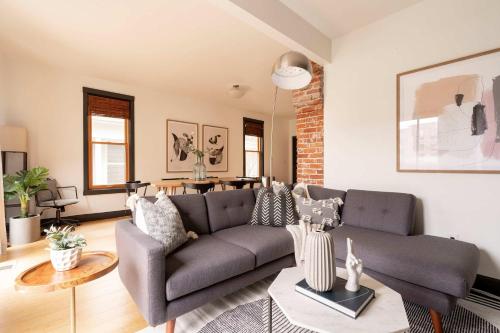 a living room with a couch and a table at Stay Portland - Scandinavian Loft - Local Espresso & Boutiques in Portland