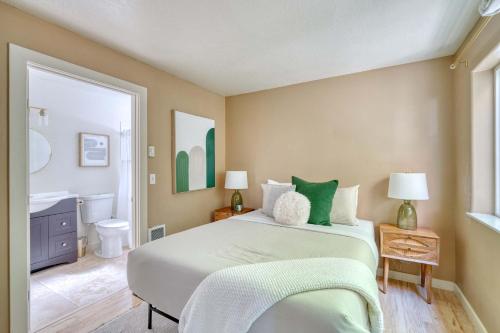 a bedroom with a large bed and a bathroom at Stay Portland - Peaceful Johns Landing Studio - Near OHSU in Marquam Hill